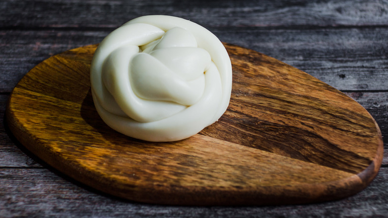 Queso de Oaxaca on a wooden cutting board