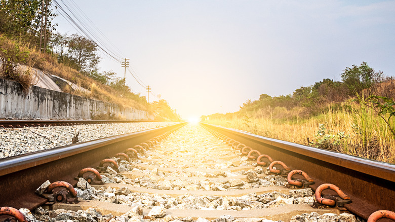 Sun at the end of the train tracks