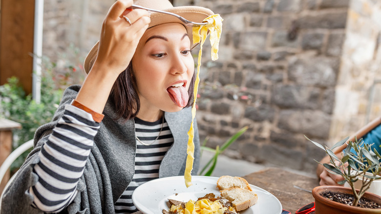 woman pasta eating outdoors truffle