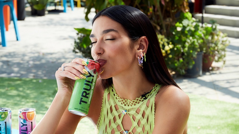 Dua Lipa sipping a Truly