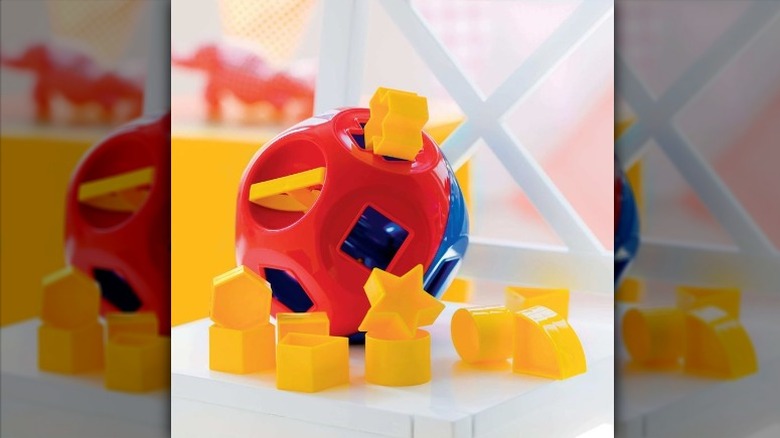 A Tupperware shape-sorting toy