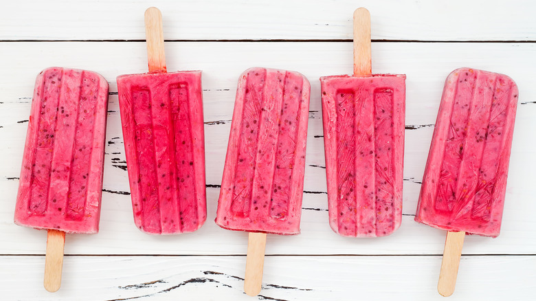 pink ice pops on white panels