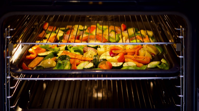 tray of roasted vegetables in an oven