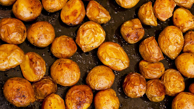 roasted new potatoes in a baking tray