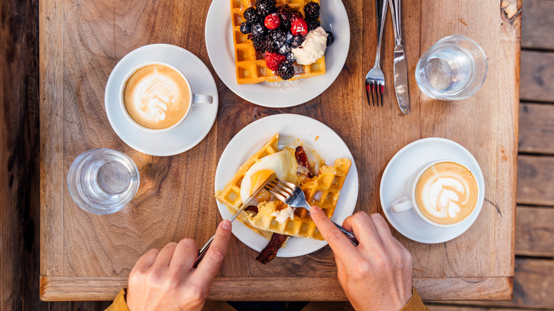 Coffee and waffles on a cafe table