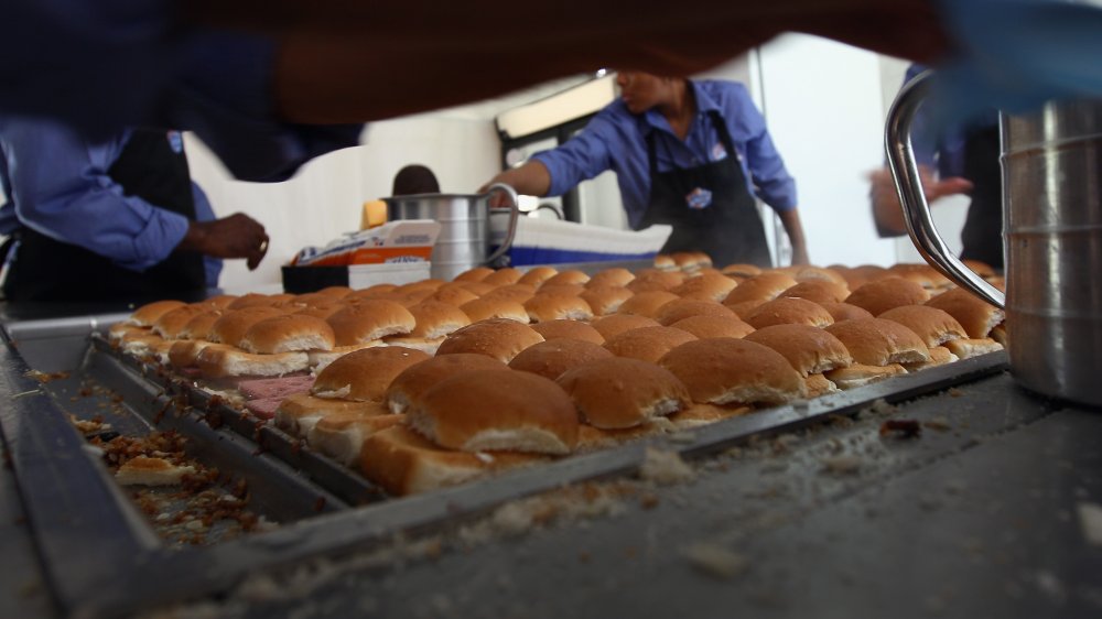 Some White Castle workers inspect the patties.