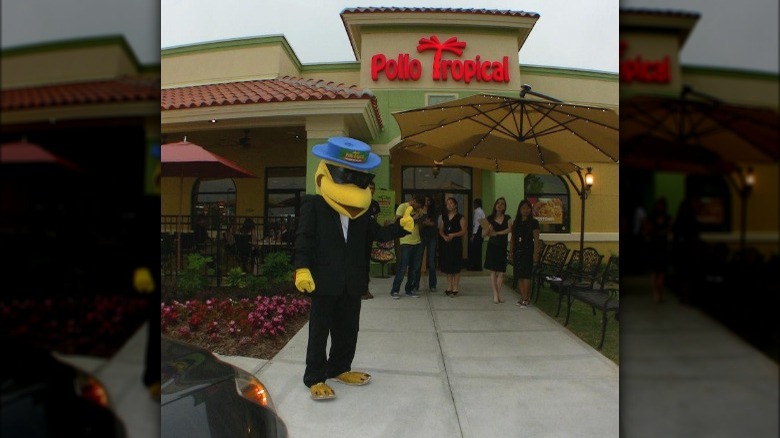 Pollo Tropical mascot with customers