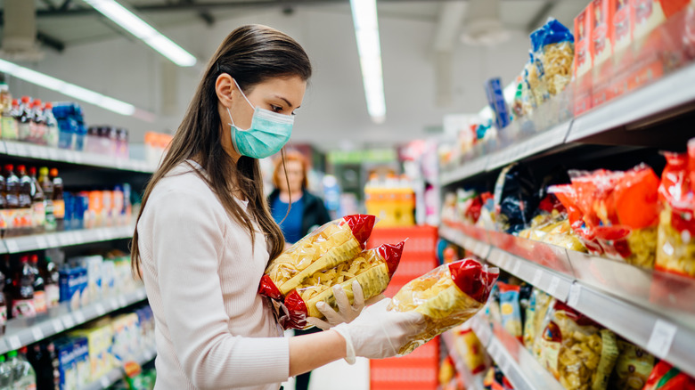 Person looking at chips at the store