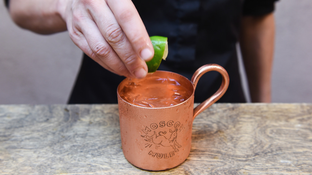 Squeezing lime into a Moscow mule