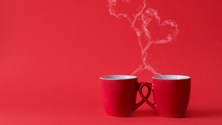 Cups with steam forming heart