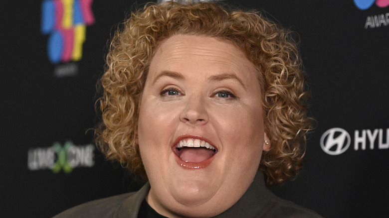 A close-up of Fortune Feimster posing at an event