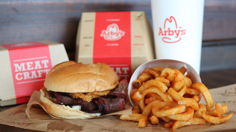 Arby's meal with sandwich, drink, and curly fries