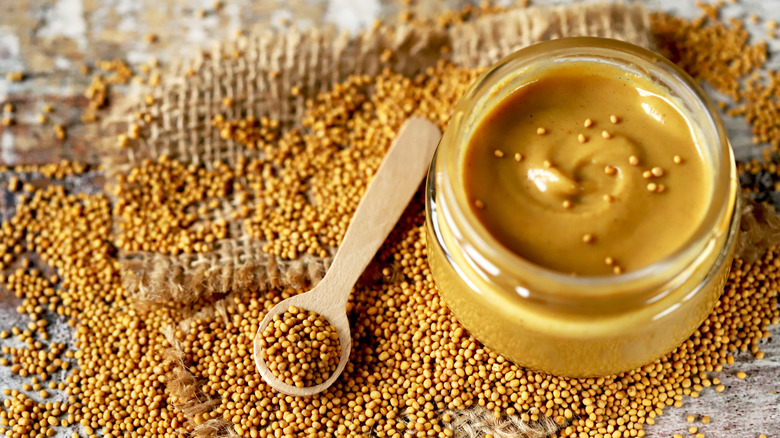 Bowl of Dijon mustard and mustard seeds