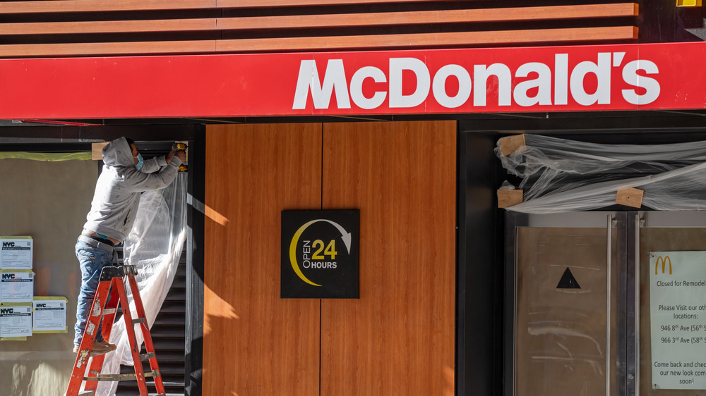 A worker tweaking a McDonald's