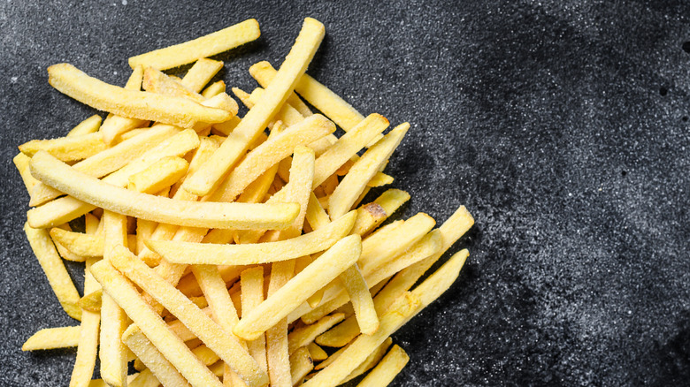 french fries on stone surface