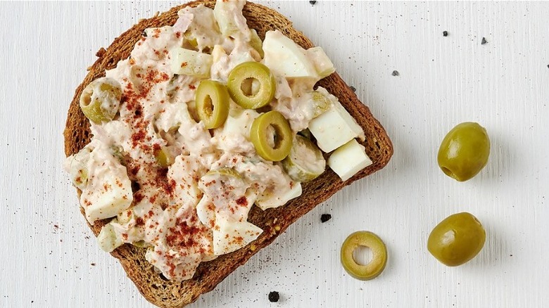 Slice of toast with tuna and olives