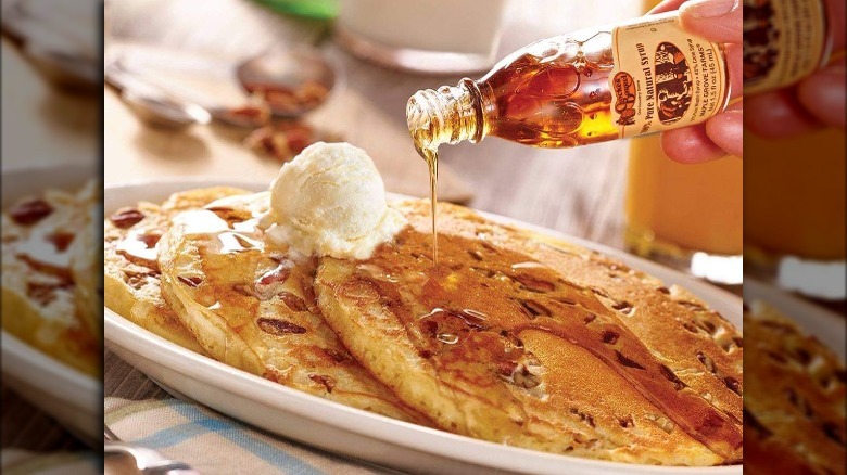 Cracker Barrel Pecan Pancakes with syrup poured over