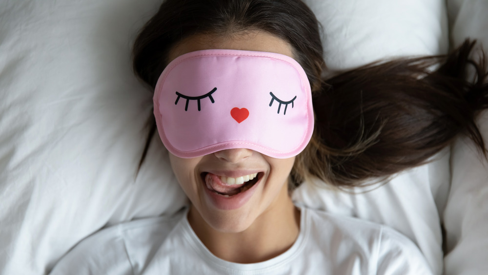 girl wearing sleep mask, sleeping