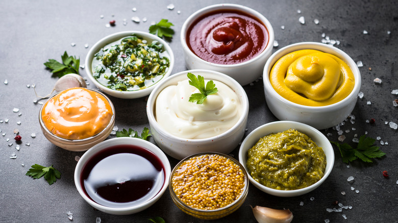 Colorful condiments in small dishes