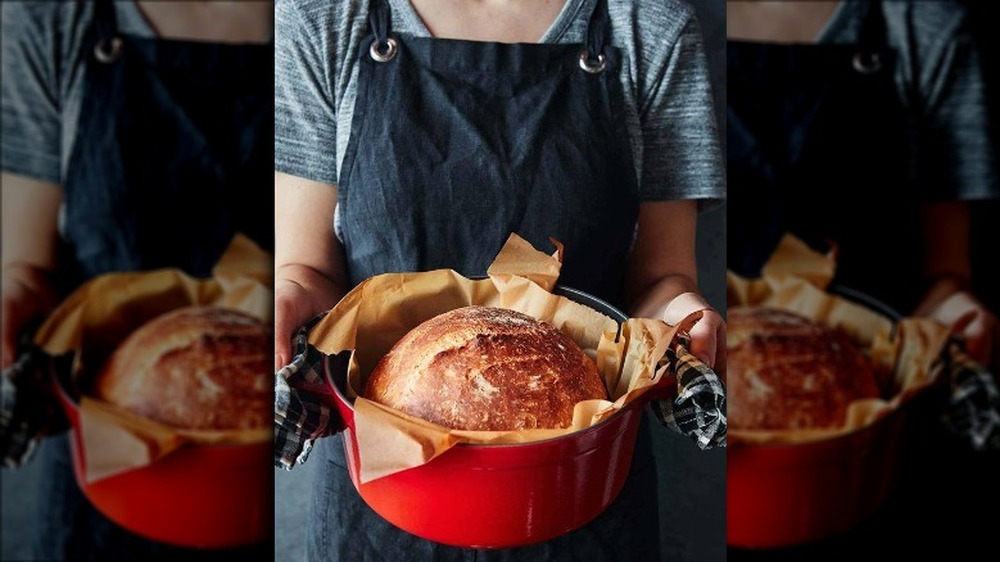 Staub Dutch oven with sourdough loaf inside 