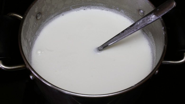 stovetop pot of simmering cream