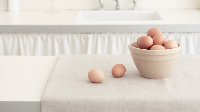 Bowl of brown eggs on counter