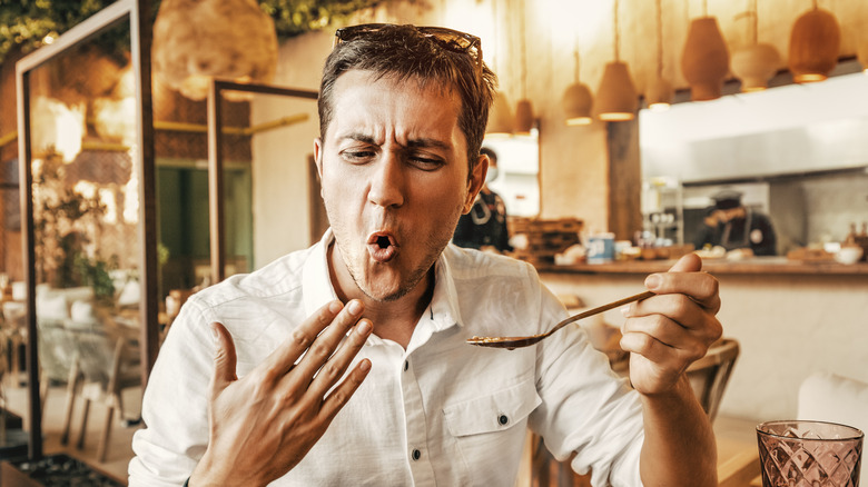 person eating spicy food