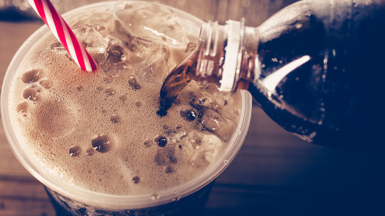 fizzy soda in a cup with a straw