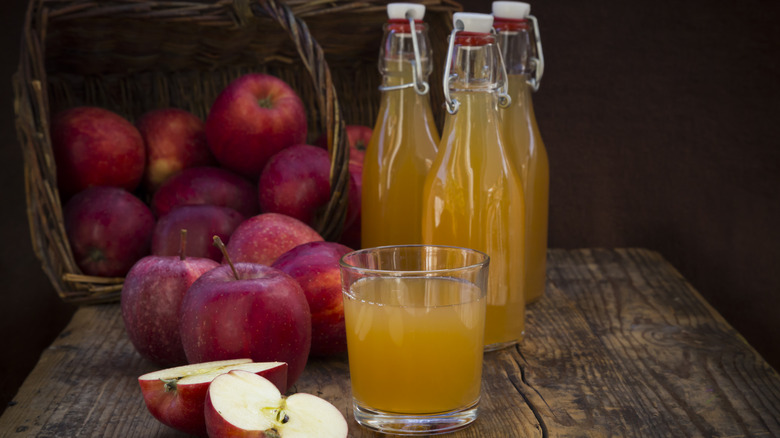 Apples with bottles of cider