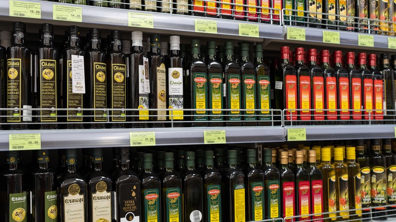 Olive oil bottles on grocery shelf