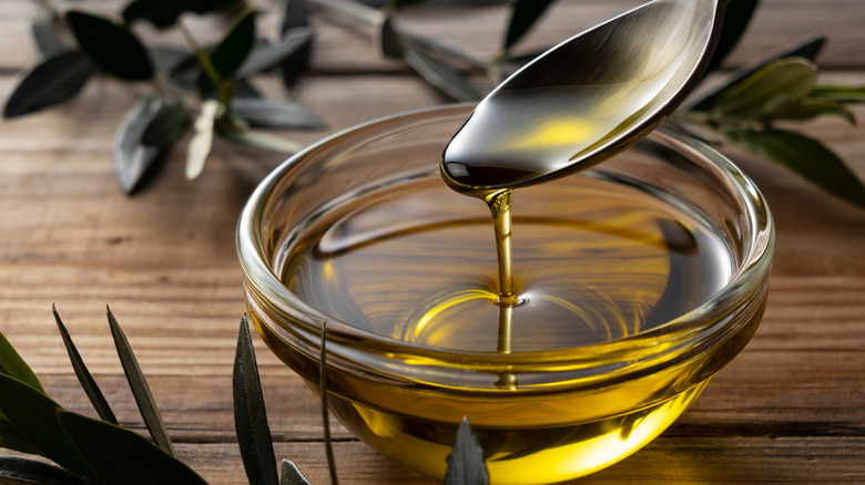 bowl of olive oil with spoon