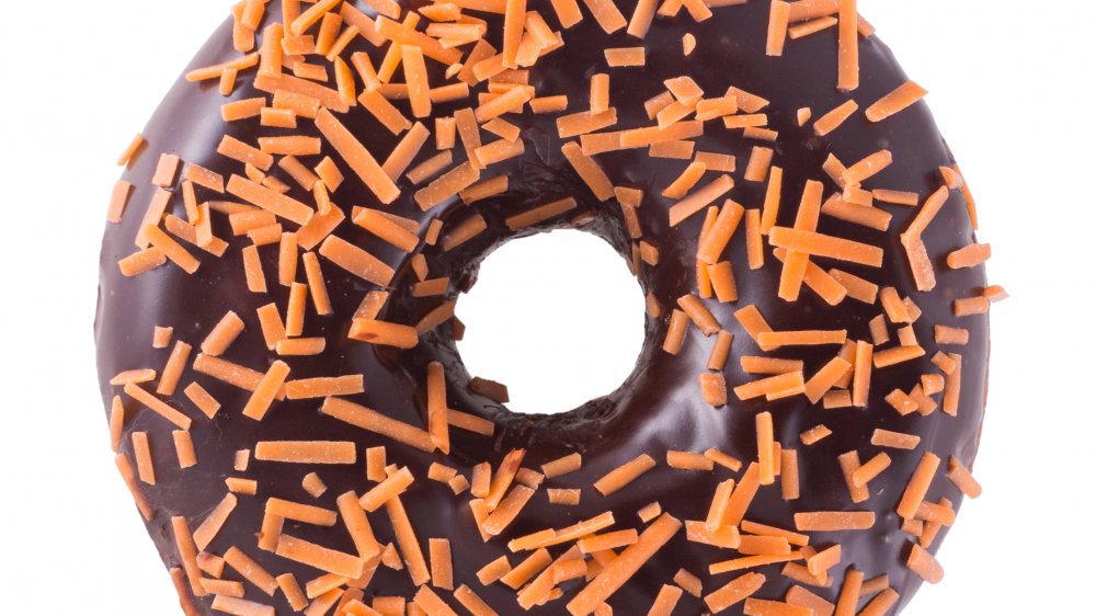 Halloween doughnut with chocolate frosting and orange sprinkles