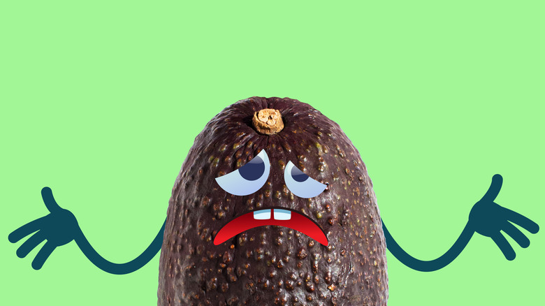 An overly ripened avocado with distraught face 