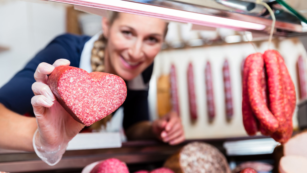 Woman in butcher shop