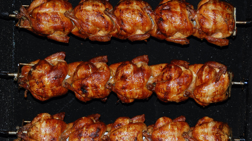 A set of skewered rotisserie chickens so gruesome that if future chickens were to somehow access the internet, they'd be horrified.