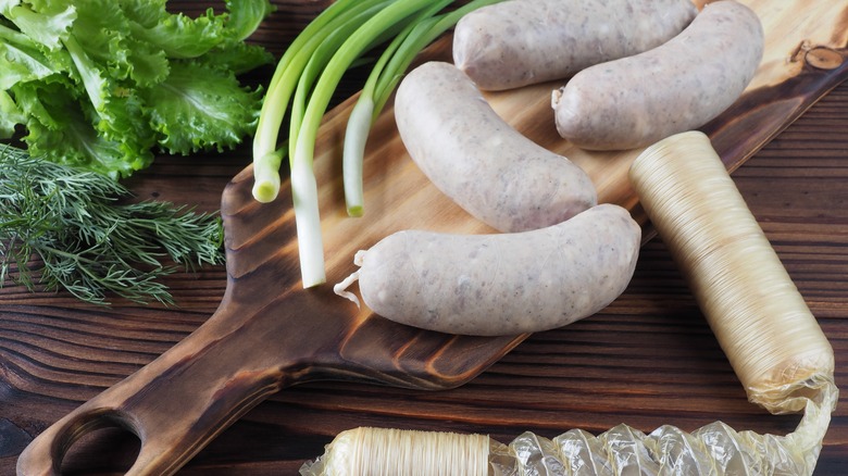 sausages with casing, green onions and other greens