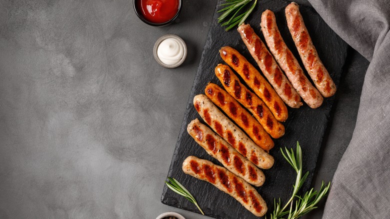 sausages on wood board