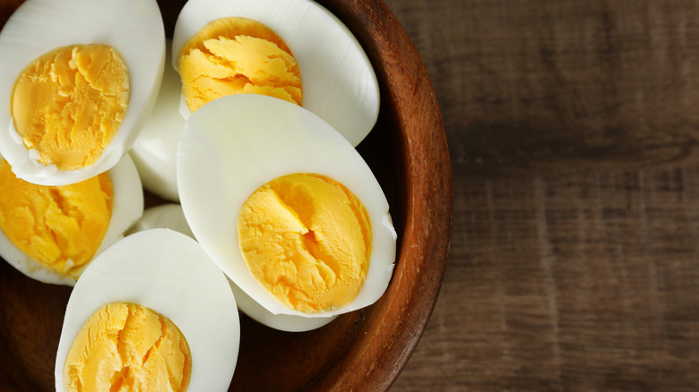 halved hard-boiled eggs in a bowl