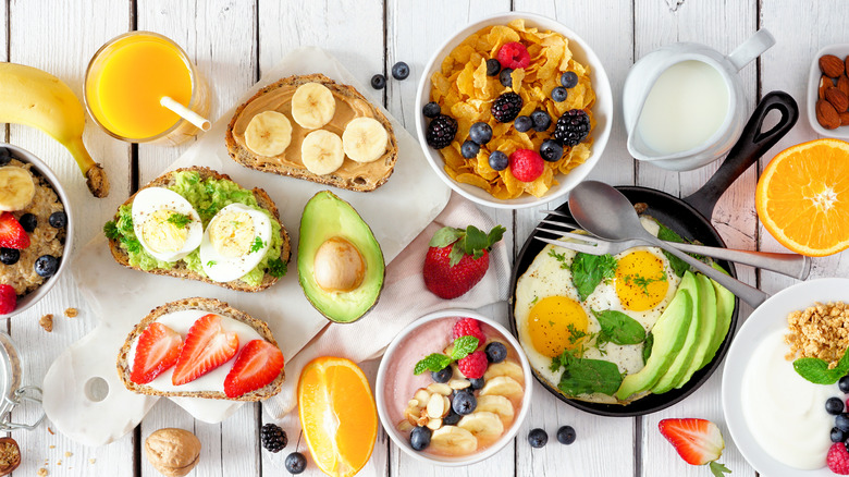 healthy breakfast spread with cereal, avocado toast, and eggs