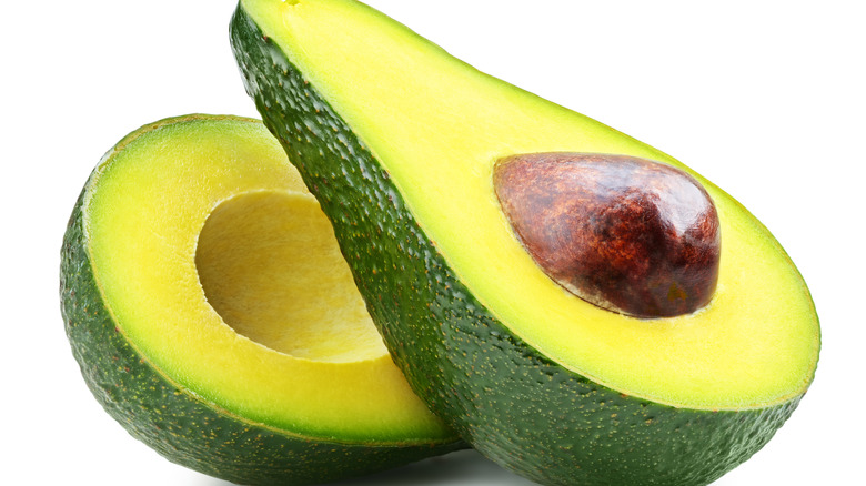 Avocados against a white background