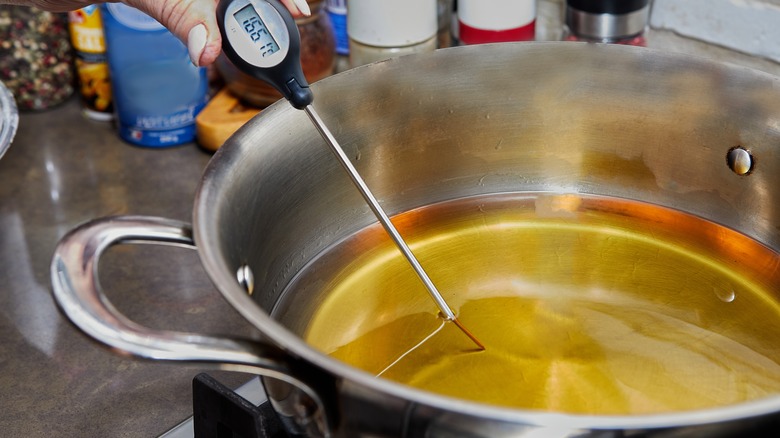 pot of oil with a thermometer inside