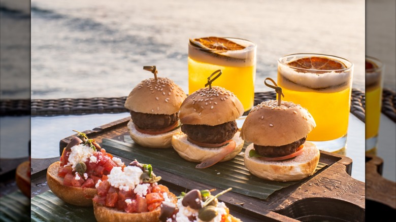 Three sliders with citrus cocktails