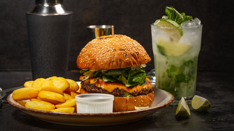 Cheeseburger and fries with Mojito