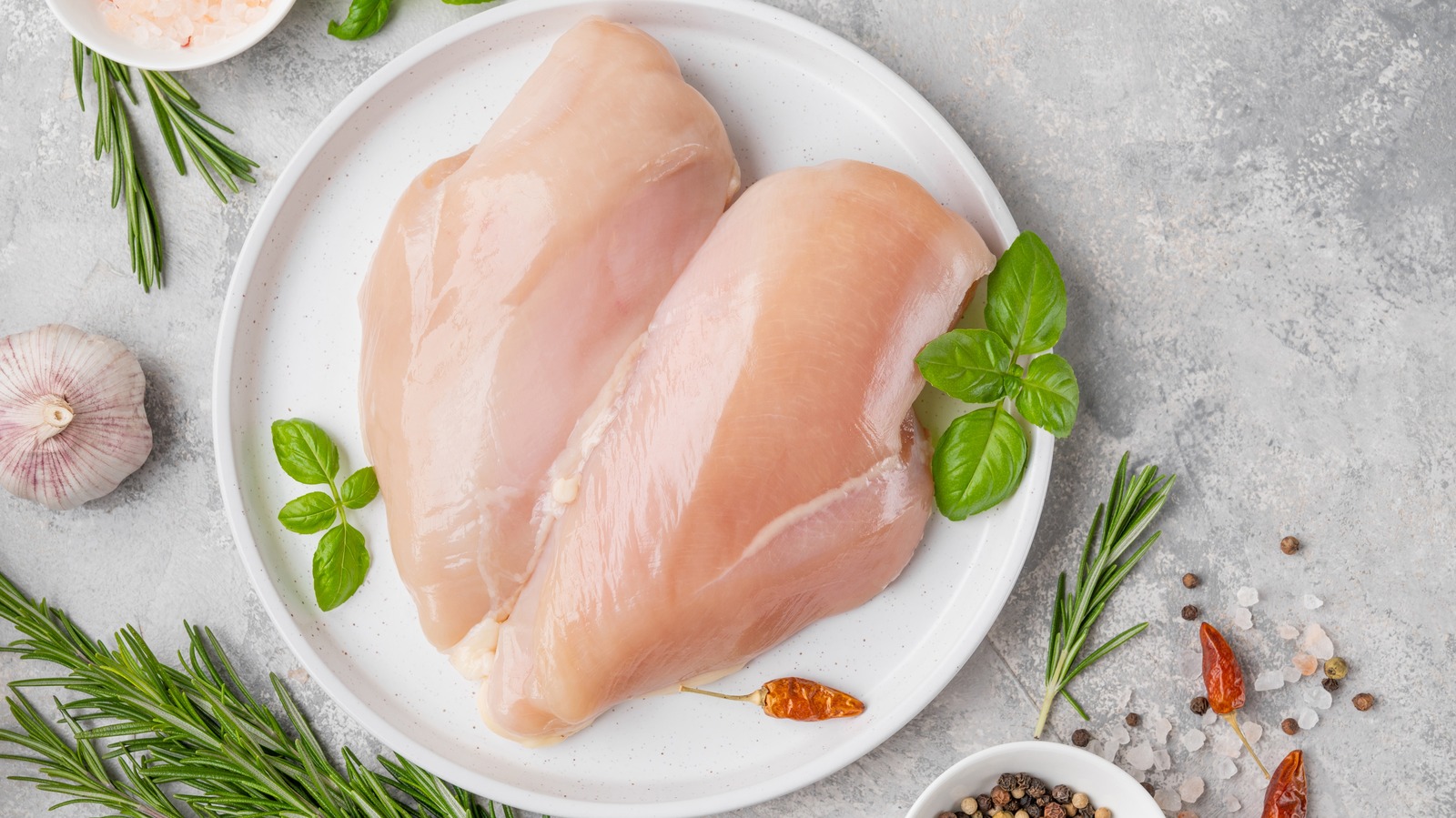 Why You Should Poke Holes In Uncooked Chicken Breast