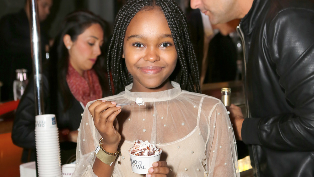 Happy woman eating gelato