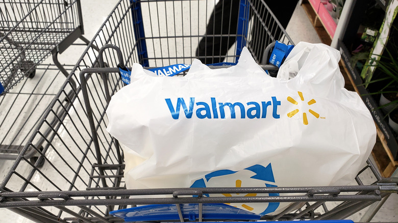 Walmart shopping cart with plastic shopping bag