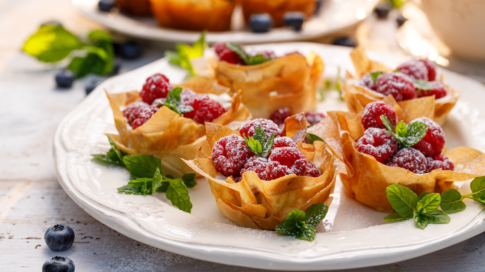 phyllo cups filled with mascarpone cheese and fresh raspberries