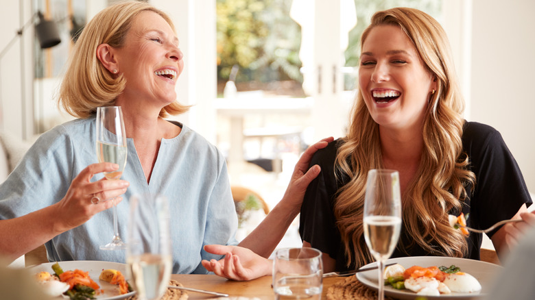 Women enjoying brunch with poached eggs