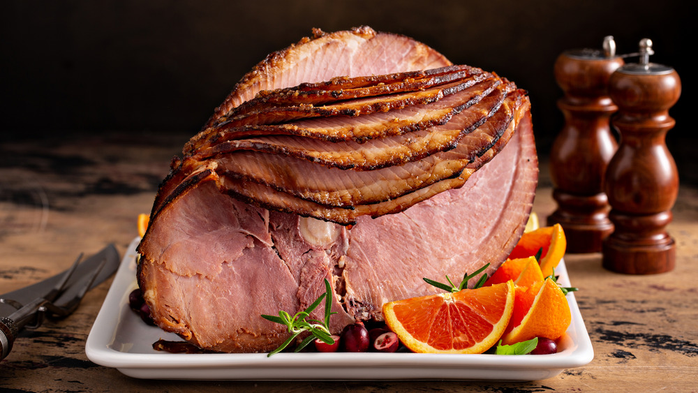 Bone-in ham on wooden surface