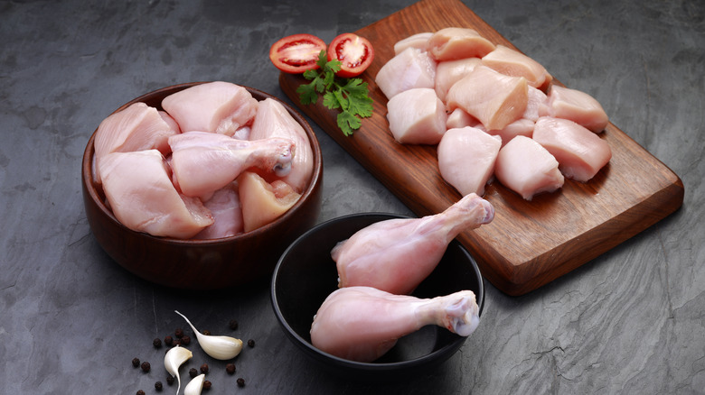 Raw chicken on cutting board